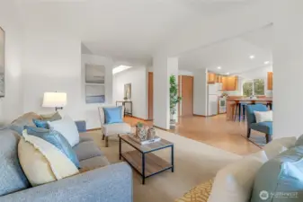 Open-concept living room w/vaulted ceilings & abundant natural light