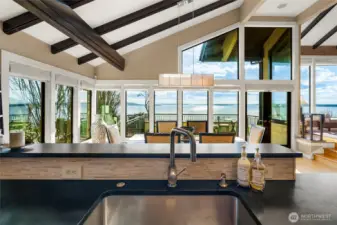 This 180 view spans from Seattle to Mt. Rainier, Alki, the Puget Sound and the Olympic mountains. This is the view from the kitchen sink!  Wonderful place to entertain and enjoy the spectacular beauty- from sunrises to sunsets- the light and the weather is fascinating!