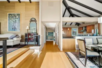 As one returns from the private view deck, this is the orientation of the living room, dining room and the kitchen.