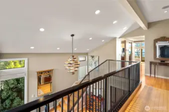 As one leaves the primary suite, you look over the formal entry