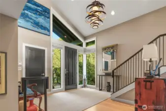 As one enters the home, the formal entry is light, bright and spacious. This is the view as one comes up the staris from the family room.