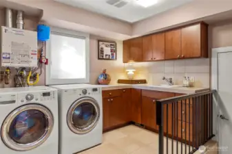 Laundry room has great storage and is just off of the two car garage.