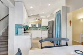 Stairs off kitchen to bonus room.