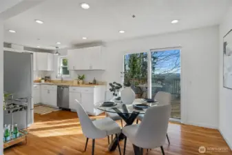 A slider off the dining area opens to a new two-tiered deck