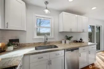 The kitchen has a window overlooking the yard