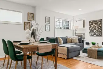 Open floor plan, hardwood floors and space for dining room table.