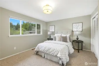 The primary bedroom on main level with large closet to the right.