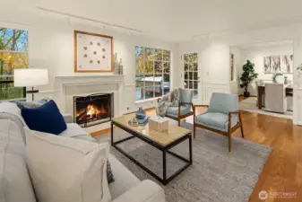 Enjoy the warm gas fireplace, rich hardwood floors, and easy access outside to the exceptional backyard.