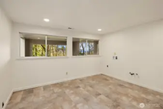 This flex space downstairs has so many lifestyle options! Check out some possibilities in the next 3 photos...