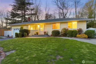 Twilight exterior with warm interior glow