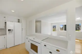 Open kitchen with plenty of prep space over looks the living area.