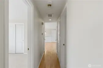 Hallway with hardwood floors.