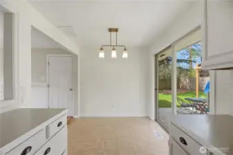 Dining area with slider to private backyard and patio.