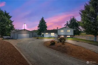 The shed located between the house and the detached garage offers lots of storage space and could be used as a studio, she shed, man cave, or whatever you envision.