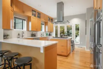 Inviting kitchen - fun to cook and entertain. Bosch appliance package in stainless steel, hardwoods, French doors to the back patio.