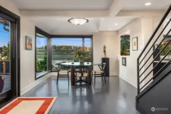 Generous dining room with huge windows bringing in the island.