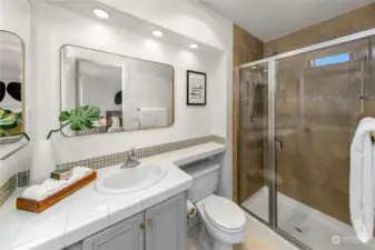 Two bedrooms with oversized windows and walk in closets are ideally positioned on opposite corners of the home for privacy —the owner’s suite with en suite bath and a second bedroom plus additional full bath.