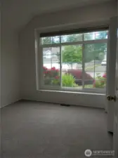 This bedroom looks to the west and the front yard area.