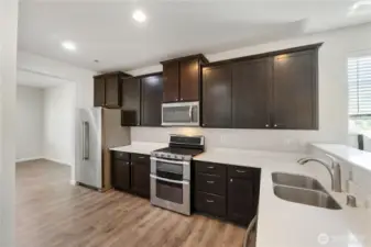 Kitchen with quartz counter tops and gas stove!