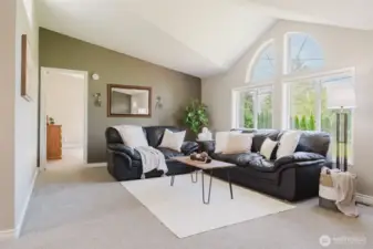 The first space that welcomes you home—this bright and open living room sets the tone with plenty of room to relax, gather, or greet guests.
