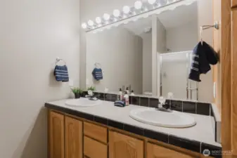 Simple and functional, with everything you need to get ready for the day or wind down at night—just steps from the primary bedroom.