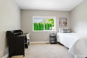 Filled with natural light, this third bedroom is ready to fit your needs—whether it's for family, guests, or a hobby room.