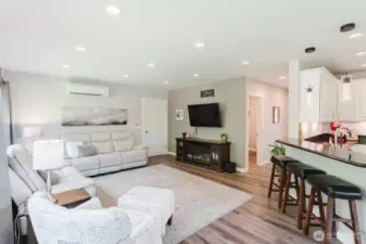 Upstairs, step into the ADU’s cozy living room—an ideal setup for relaxing, hosting, or giving guests their own space to unwind. With a separate entrance from the downstairs, it could easily be rented out on it's own in addition to the downstairs office/man cave space.