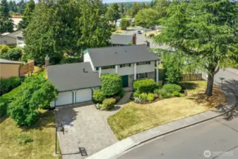 With your corner location, your gorgeous driveway, and your brick and clapboard exterior, your home makes a dramatic impression. The brand new roof helps with that, as well!