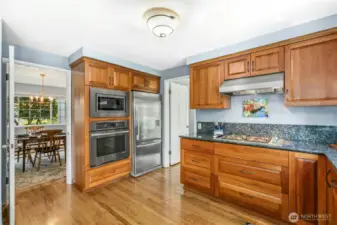 The kitchen opens to the living, dining, and family rooms. It's truly the center of the home.