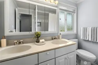 The hall bath has twin sinks for easy sharing.