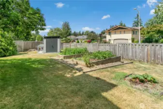 The shed gives you space for all your garden tools, and note the potting bench!