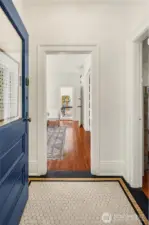 Classic era details throughout. What's not to love about the original front door and period tile entry?