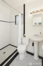 Fresh main floor bath was completely re-done in 2019 and perfectly echos the character of the home.