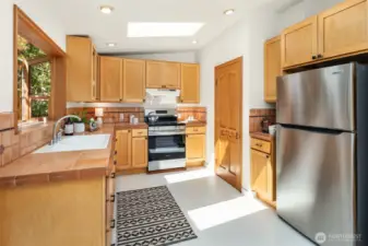 New appliances in the eat in kitchen with French doors leading to the rear garden and raised deck.