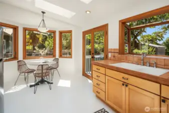 New appliances in the eat in kitchen with French doors leading to the rear garden and raised deck.