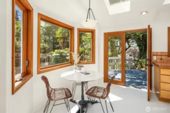 New appliances in the eat in kitchen with French doors leading to the rear garden and raised deck.