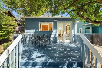Lovely back deck conveniently located off the kitchen. Al fresco dining with a western view of Downtown Seattle.