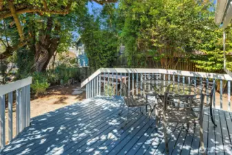 Lovely back deck conveniently located off the kitchen. Al fresco dining with a western view of Downtown Seattle.