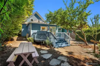 Lovely back deck conveniently located off the kitchen. Al fresco dining with a western view of Downtown Seattle.
