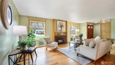 Boasting natural light and a gas fireplace, this living area offers warmth and comfort in every season.