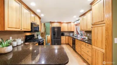 Abundant cabinet storage and expansive countertops make this kitchen as functional as it is beautiful.