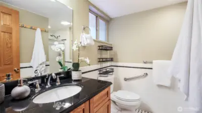 Enjoy this bright primary bathroom featuring a sleek vanity and a convenient walk-in shower for everyday comfort.