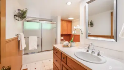 Convenient full bath with sliding glass shower doors and a bright layout.