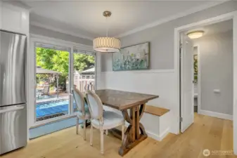 Dining area with built-in storage bench seating.