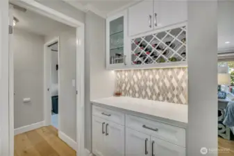 Bar, coffee, or beverage station with additional storage and built-in wine rack.