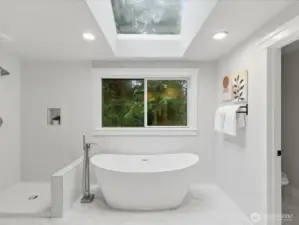 Stand alone tub and beautifully tiled shower and surround. (glass on order)