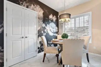 Dining Room. The double doors open to the pantry for extra storage