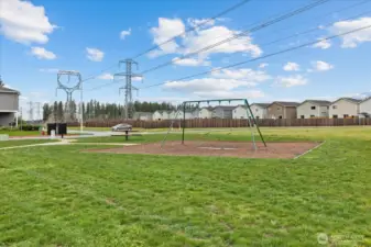 Large open park area kitty-corner to the house.