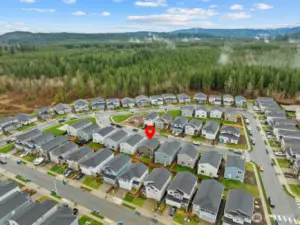 Aerial view of the home and neighborhood looking southward.