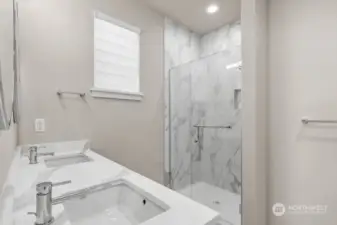 Primary bathroom with the full height tile shower.